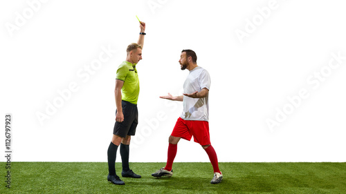 Young referee showing yellow penalty card to emotional man  soccer player shouting and arguing in disagreement isolated on white background. Concept of sport  fair play  competition  control  rules