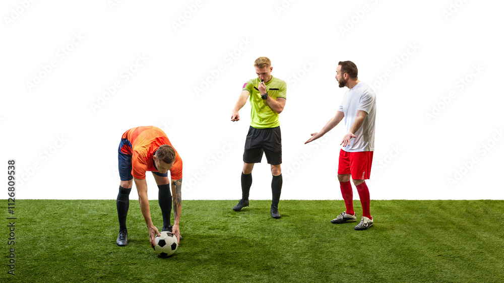 Soccer referee blowing a whistle and making gesture to signal foul while player prepares to take penalty, highlighting rule enforcement in game. Concept of sport, fair play, competition, control Soccer referee blowing a whistle and making gesture to signal foul while player prepares to take penalty, highlighting rule enforcement in game. Concept of sport, fair play, competition, control