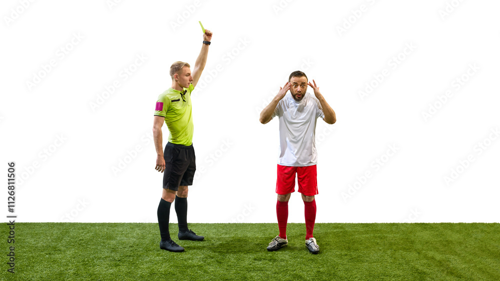 Referee raising yellow card to man, player showing confused expression, illustrating caution warning in soccer game, isolated on white background. Concept of sport, fair play, competition, control Referee raising yellow card to man, player showing confused expression, illustrating caution warning in soccer game, isolated on white background. Concept of sport, fair play, competition, control