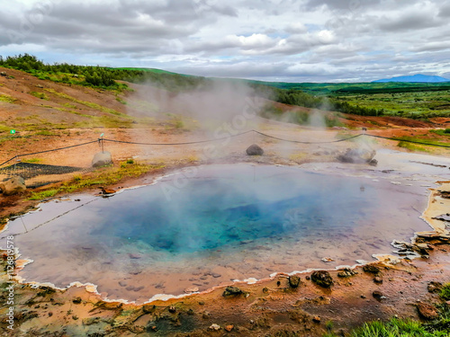 Geysir Geothermal Area, Haukadalur Valley with the bubbling mud pools and hot springs