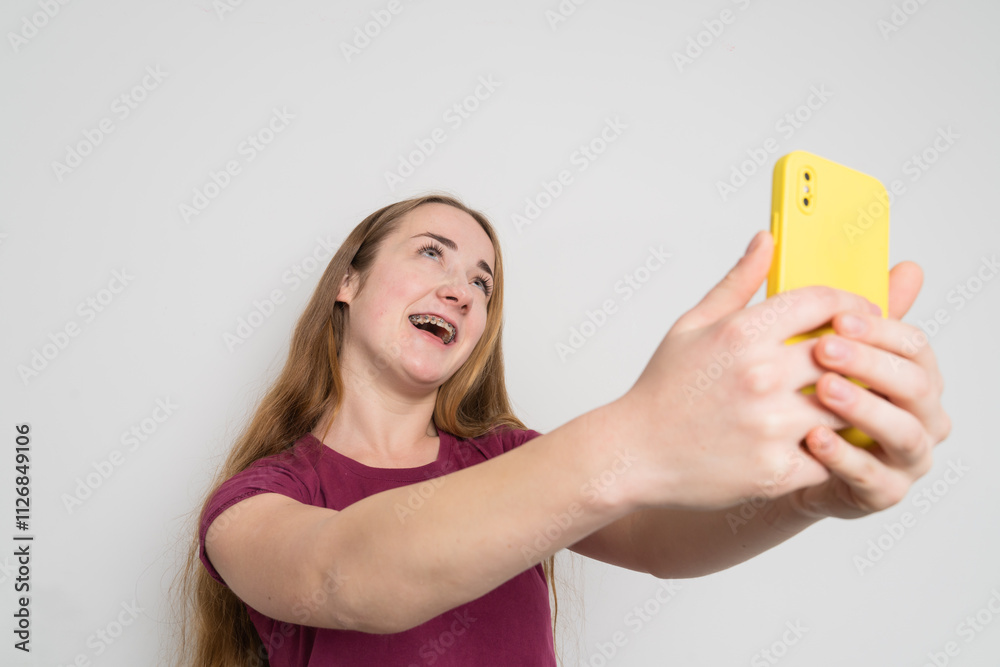 Young beautiful girl uses modern smartphone at home Young beautiful girl uses modern smartphone at home