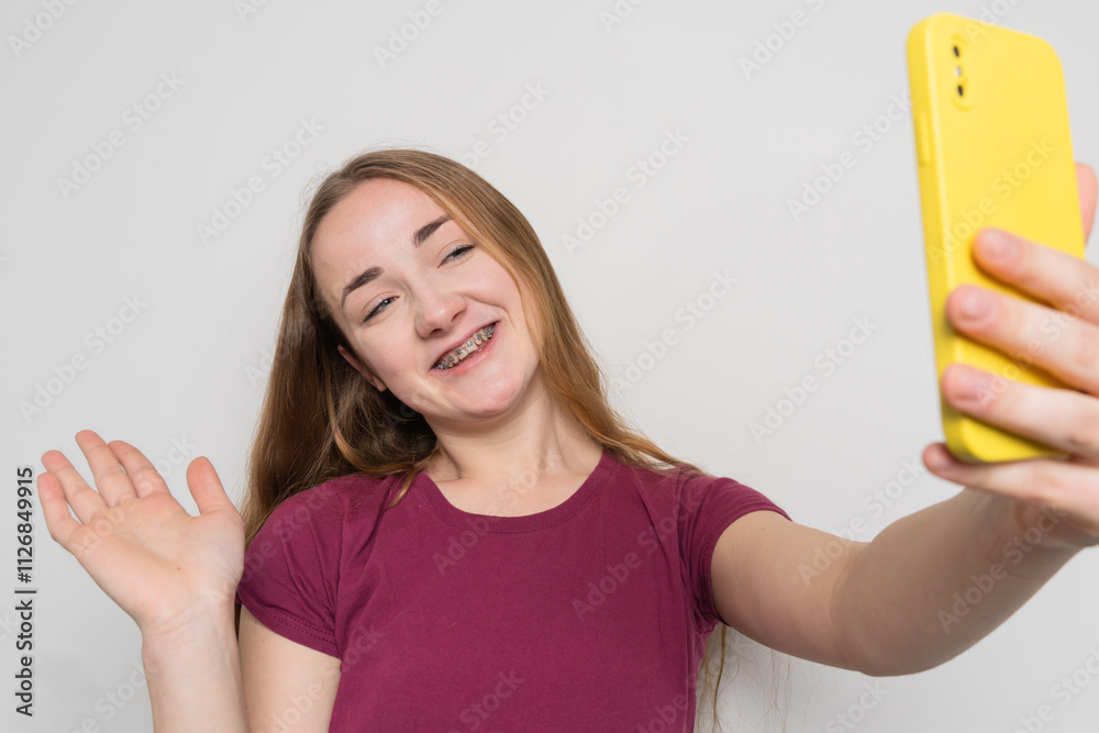 Young beautiful girl uses modern smartphone at home Young beautiful girl uses modern smartphone at home