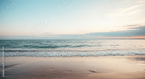 Serene sunset at the tranquil beach with gentle waves