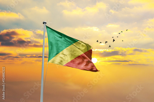 Waving flag of Congo against sunset or sunrise. Congo flag for Republic Day and Independence Day. photo