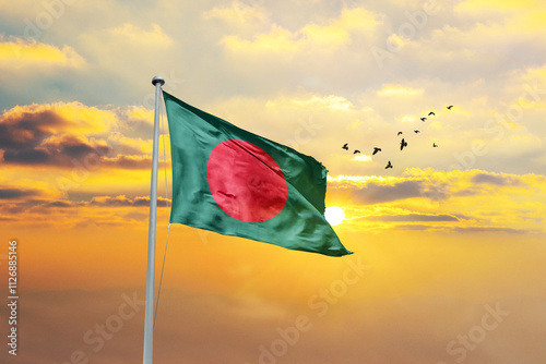 Waving flag of Bangladesh against sunset or sunrise. Bangladesh flag for Republic Day and Independence Day. photo