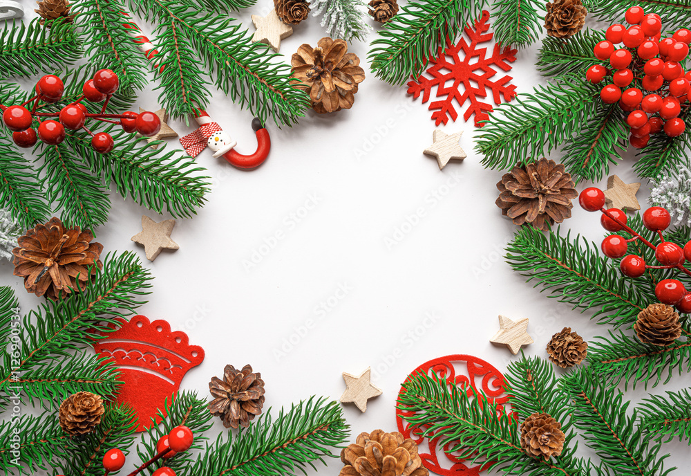 Christmas background. Christmas eve concept. Top view of gift boxes, fir branches, toys, on white background.