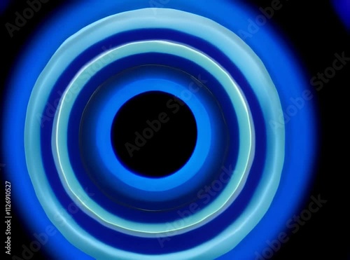 animation of gentle loop of concentric circles softly expanding and contracting, each ring changing colors