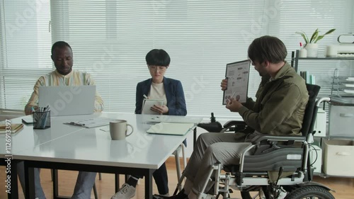 Wallpaper Mural Pan shot of Caucasian businessman with disability meeting with diverse coworkers at office for financial perspectives discussion Torontodigital.ca