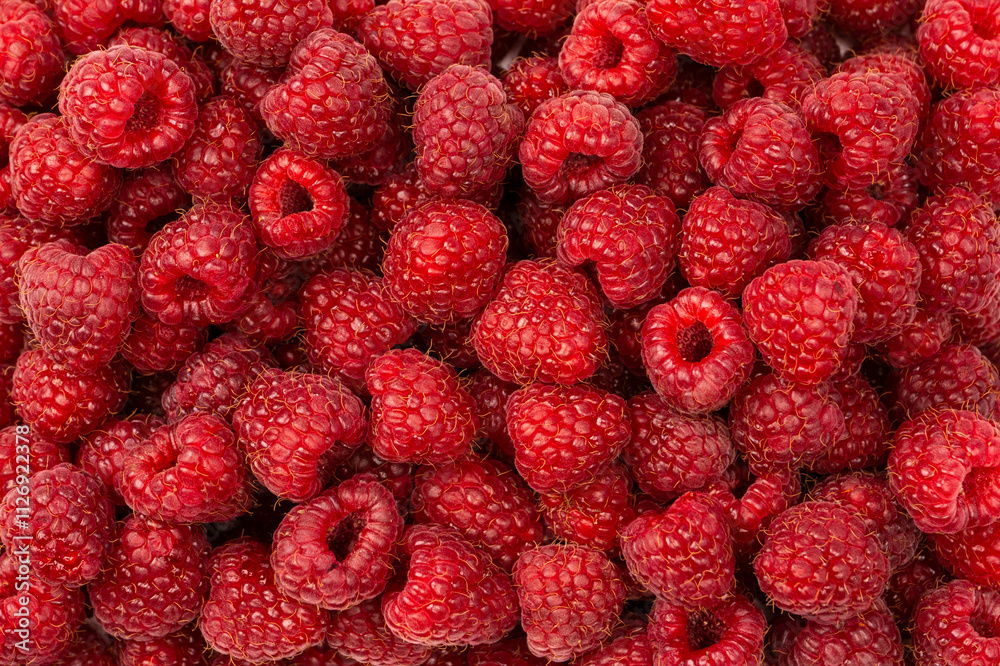 Tasty fresh raspberry as a background. Tasty fresh raspberry as a background.