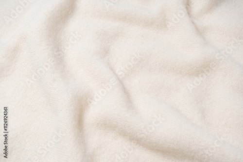 Beige sweater texture as a background.