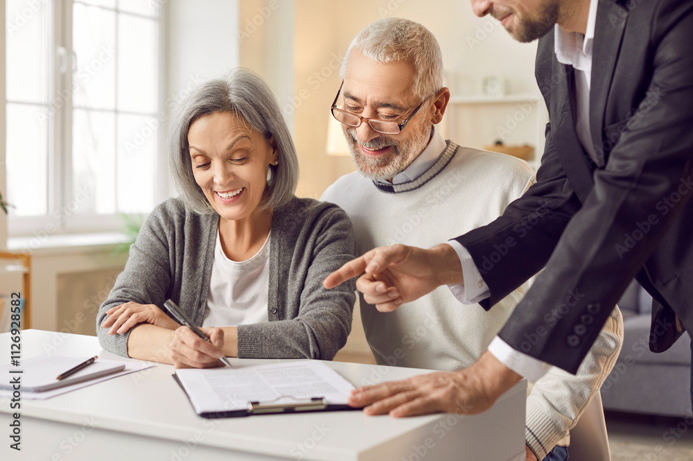 Obraz premium Senior couple happy filling document at appointment in lawyer office, agent helping to sign medical treatment contract, insurance agreement, medic care paperwork to sign agreement, legal support