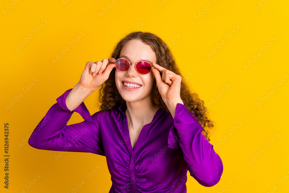 Naklejka premium Photo portrait of attractive young woman sunglass fashionista dressed stylish violet clothes isolated on yellow color background