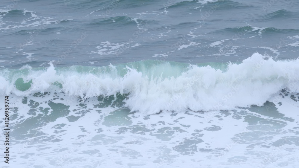 Powerful sea water wave crashing on the shore, creating a foamy splash, sea, motion, surf Powerful sea water wave crashing on the shore, creating a foamy splash, sea, motion, surf