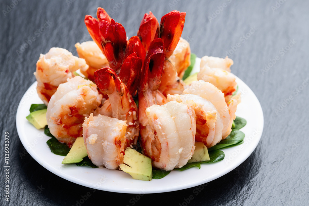 Salad with tiger shrimps , avocado and mango . Top view Salad with tiger shrimps , avocado and mango . Top view