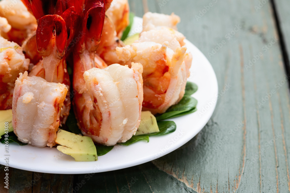 Salad with tiger shrimps , avocado and mango . Top view Salad with tiger shrimps , avocado and mango . Top view