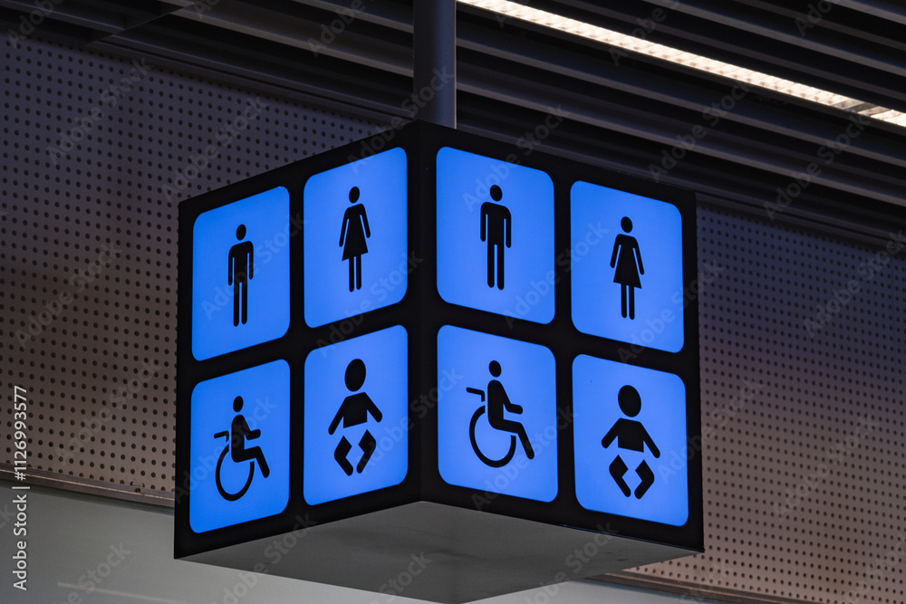 Restroom sign blue lit and black. wc for wheelchairs, Male, Female, baby care Restroom sign blue lit and black. wc for wheelchairs, Male, Female, baby care