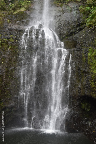 The stunning big wateralls running over the black lava rocks on Maui Island in Hawaii