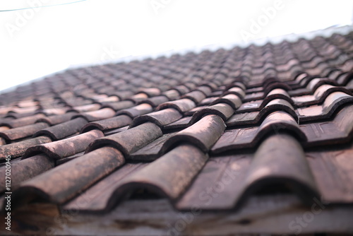 Rooftiles that have been eaten away by age. pattern rooftile,rows of rooftiles lined up