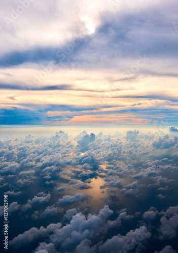 Wallpaper Mural clouds in the sky at sunset as seen through window of an aircraft Torontodigital.ca