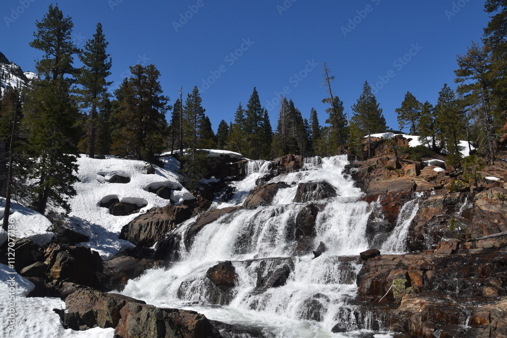 The turquoise azure blue Lake Tahoe and the surrounding mountains and forest The turquoise azure blue Lake Tahoe and the surrounding mountains and forest