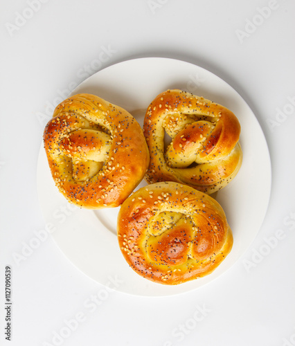 Sweet bread rolls with sesame seeds and poppy seeds..