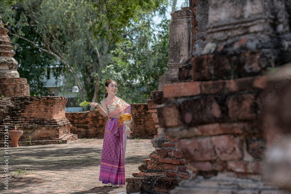 women in traditional clothing on Buddhist on background. Portrait women in traditional clothing , Thai traditional in Ayutthaya, Thailand. women in traditional clothing on Buddhist on background. Portrait women in traditional clothing , Thai traditional in Ayutthaya, Thailand.