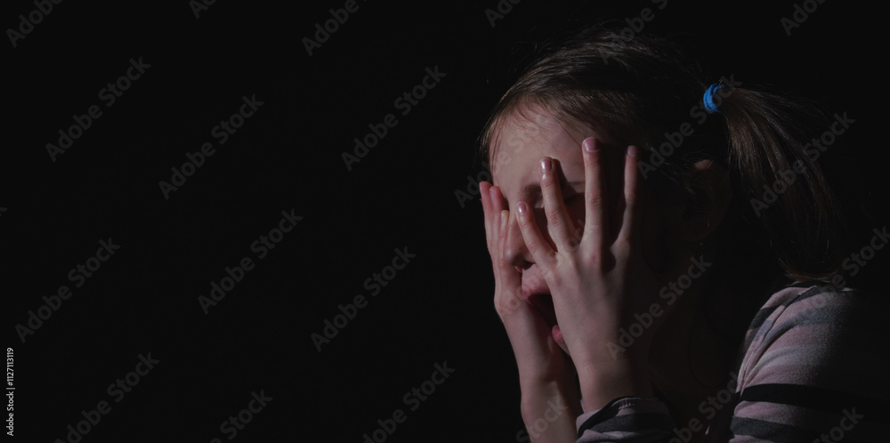 Stressed, unhappy young adolescent girl crying and feeling exhausted or depressed alone. Horizontal image. Stressed, unhappy young adolescent girl crying and feeling exhausted or depressed alone. Horizontal image.