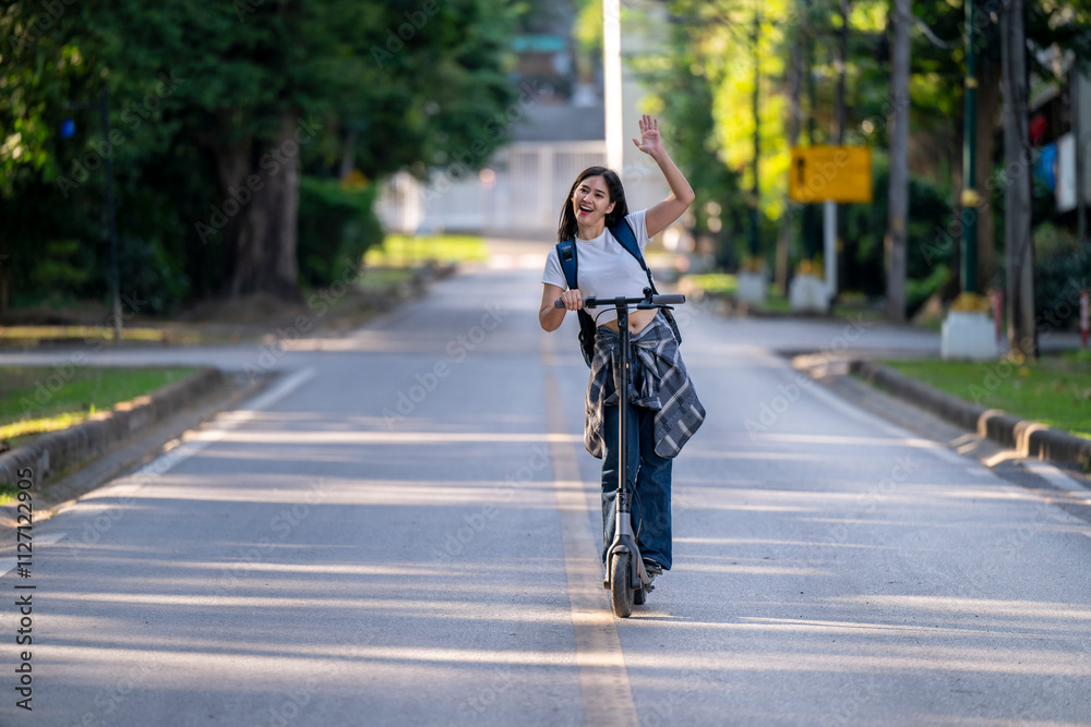 Naklejka premium A woman is riding a scooter down a street