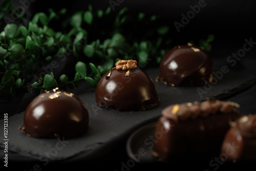 Delicious mousse cakes coated in chocolate glaze