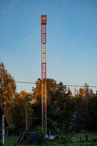 tall fire observation tower in Latvia countryside