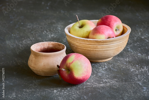 Still life with apples and ceramic dishes 