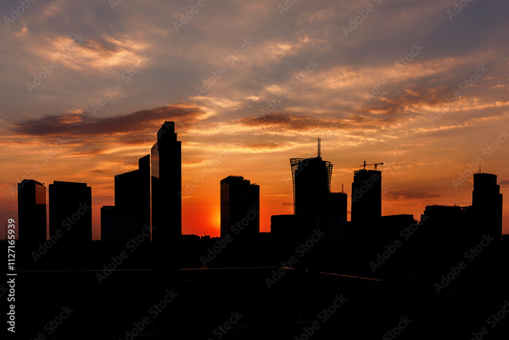 A Sunset Over the City Skyline, Illuminating the Urban Landscape A Sunset Over the City Skyline, Illuminating the Urban Landscape