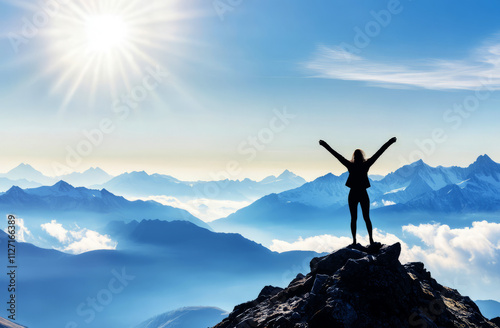 Silhouette of a man standing on top of a mountain with arms raised in victory, 