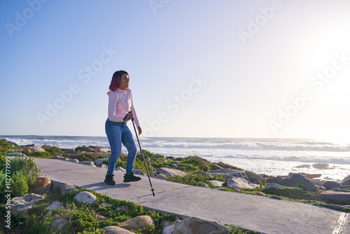 Woman with spastic diplegia cerebral palsy on footpath