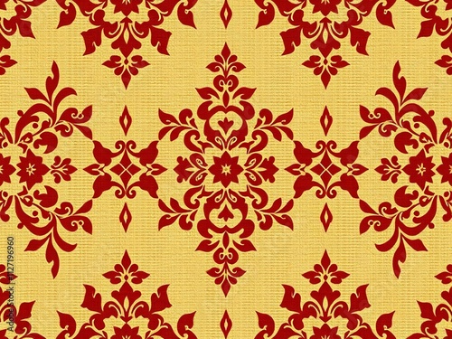 Red damask pattern on gold textured background. photo