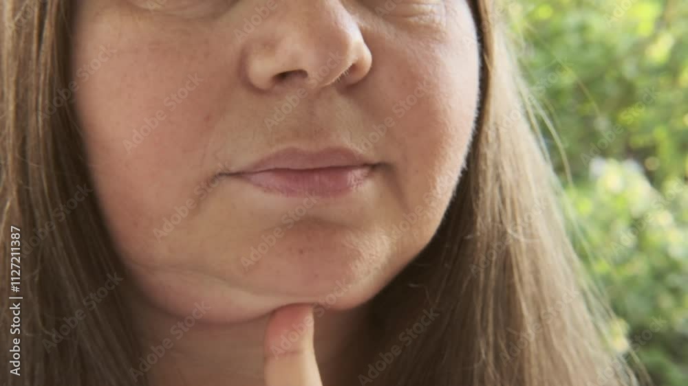 closeup face mature woman 55 years old, human fat neck, double saggy chin, Aging and Facial Appearance, age-related skin changes, cosmetic anti-aging procedures, skin tightening closeup face mature woman 55 years old, human fat neck, double saggy chin, Aging and Facial Appearance, age-related skin changes, cosmetic anti-aging procedures, skin tightening