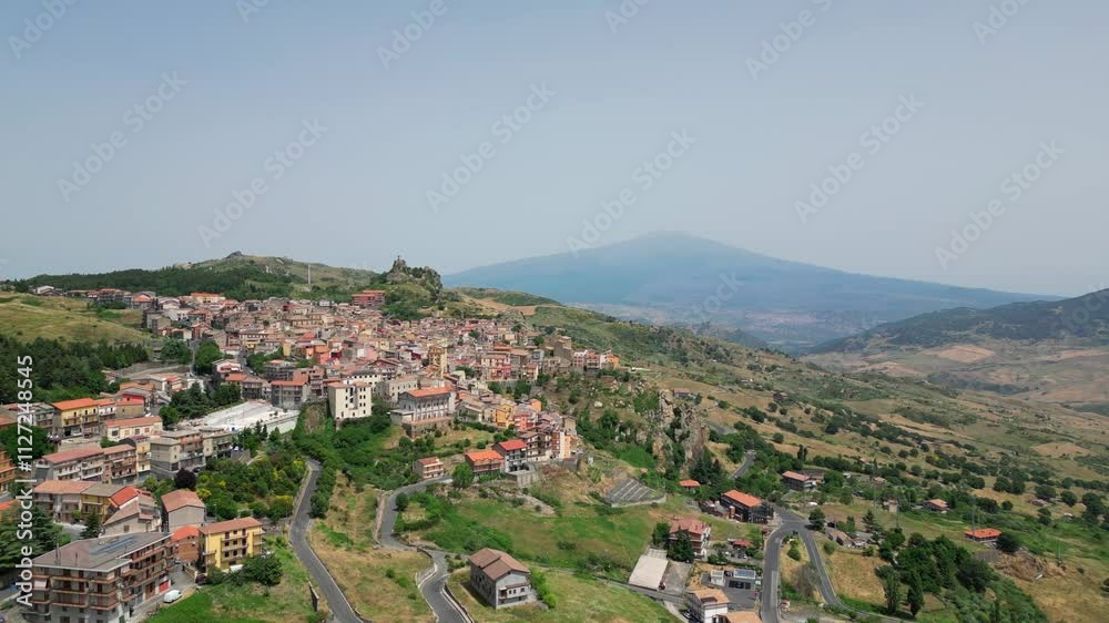 View of the city of Cesaro with Mount Etna in the background View of the city of Cesaro with Mount Etna in the background