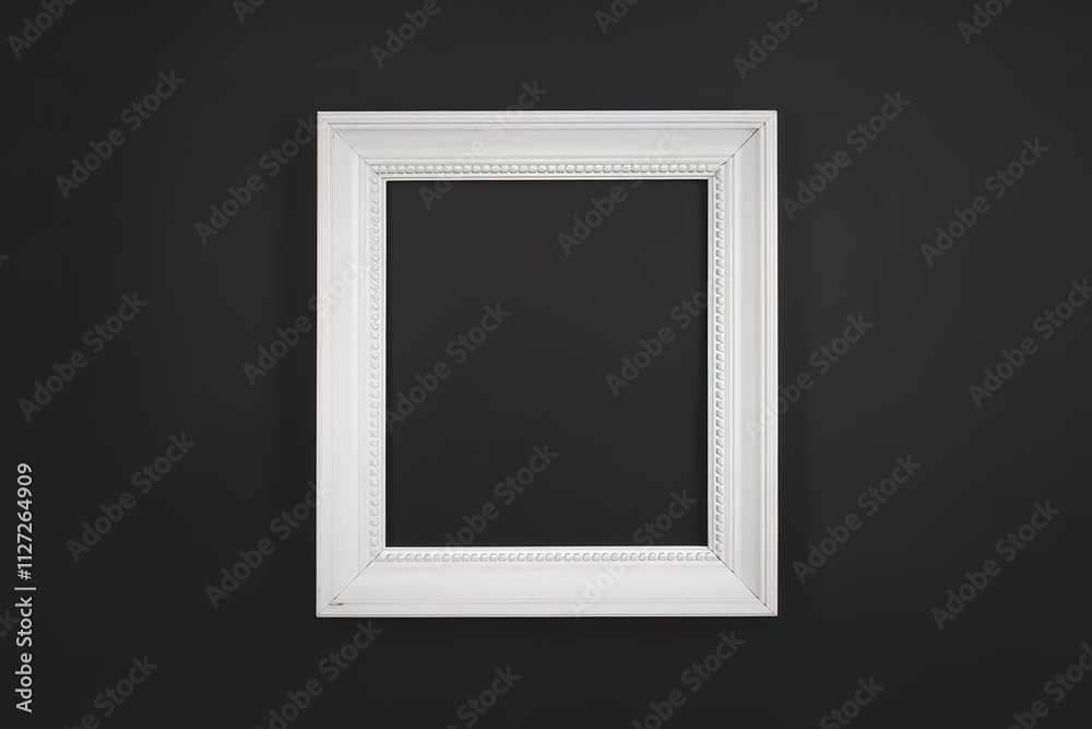 photo of a white rectangular frame placed against a black background photo of a white rectangular frame placed against a black background