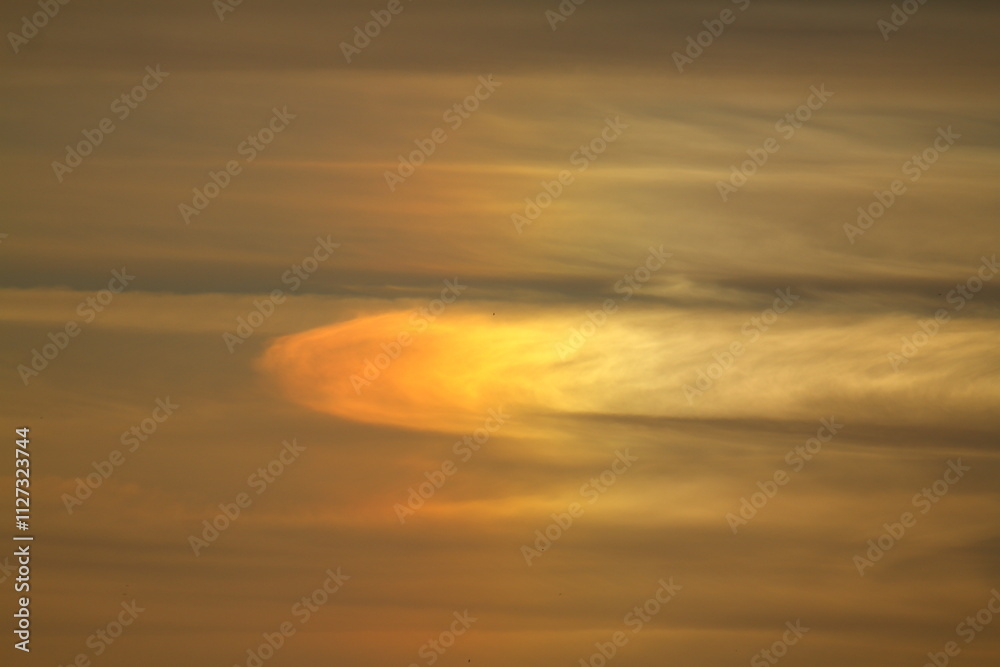 Fototapeta premium Blurry background of red sunset sky. Dramatic sky with colorful cloud background. Red burning sunset sky. Copy space.