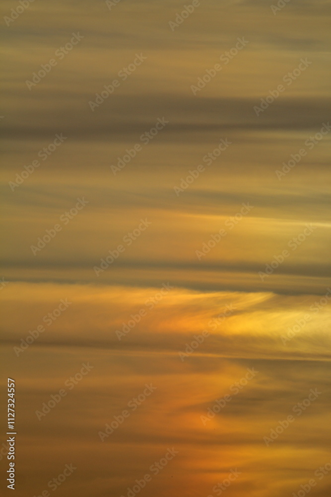 Fototapeta premium Blurry background of red sunset sky. Dramatic sky with colorful cloud background. Red burning sunset sky. Copy space.