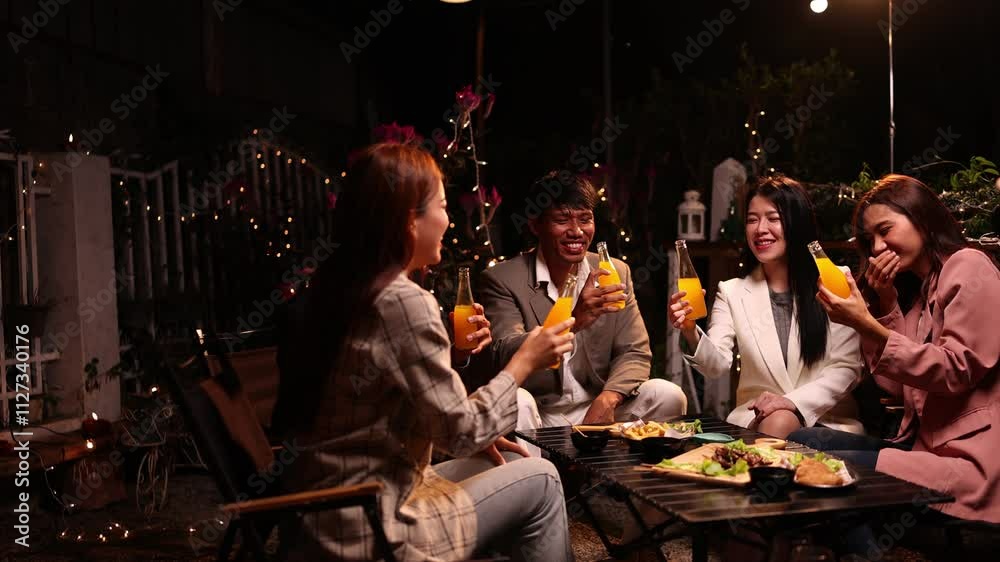 Group of friends clinking glasses in celebration at night, Happy group of friends having celebration and drinking dinner party at night, Holiday, Festival celebration. Group of friends clinking glasses in celebration at night, Happy group of friends having celebration and drinking dinner party at night, Holiday, Festival celebration.