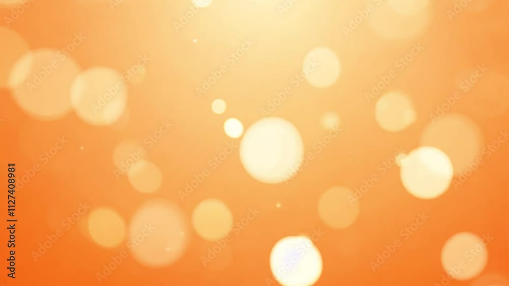 Zoom out video of a light orange background with shimmering bokeh lights and randomly scattered, small sparkles