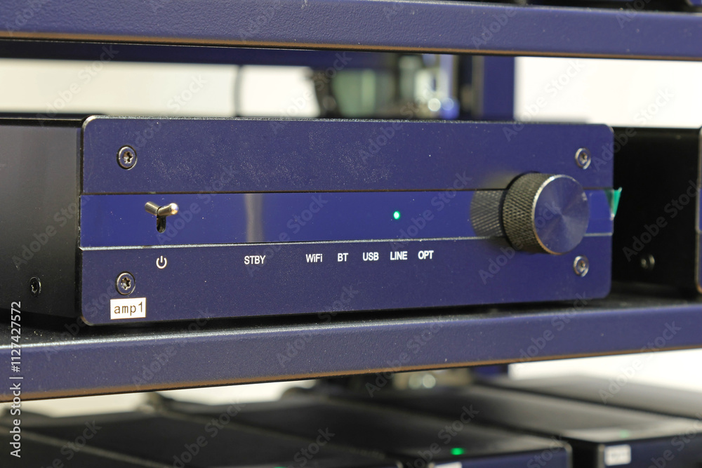 A high-quality audio amplifier for home use, installed in a telecommunications rack. A high-quality audio amplifier for home use, installed in a telecommunications rack.