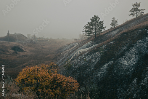 Foggy autumn landscape with chalk hills and trees captured in Kupiansk (Ukraine) photo