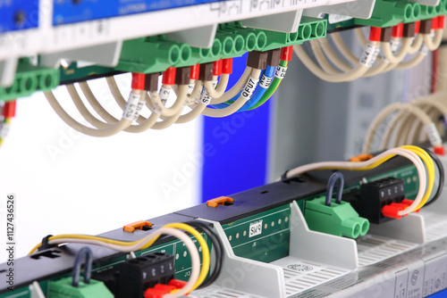 Connection of electrical modules using insulated mounting wires. Close-up. Soft focus.