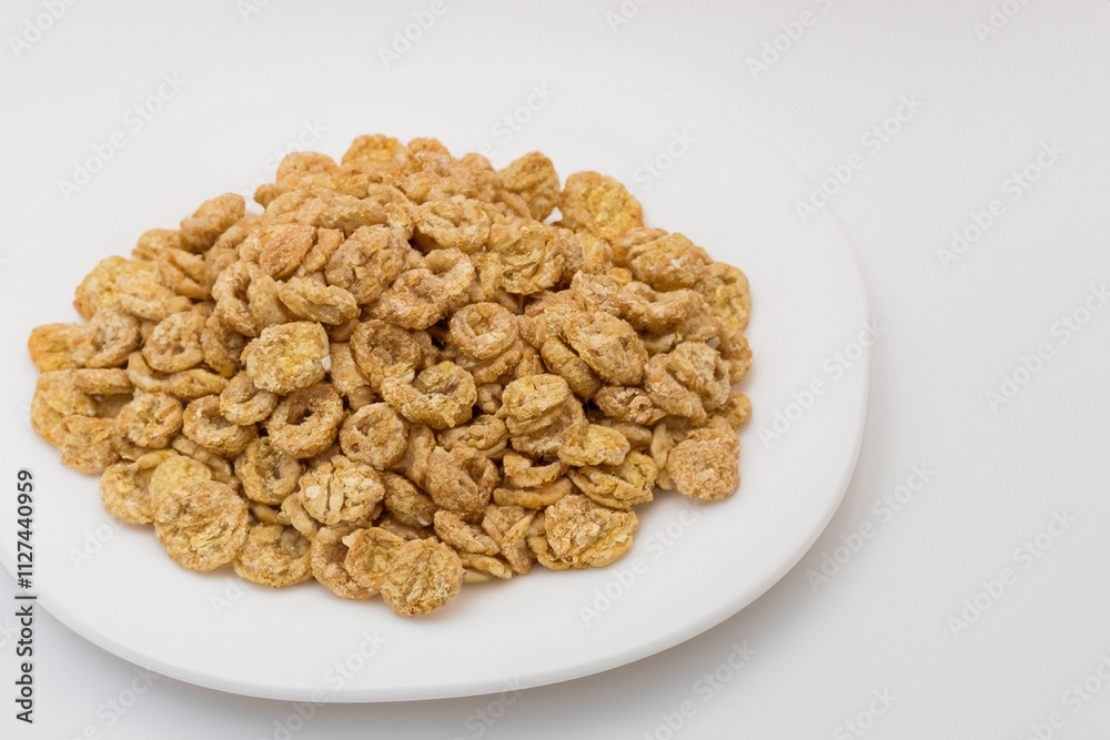 Of cereal on white background. Of dry cereal with white. A plate of cereal lies on a white plate. A plate of cereal lying on a white lifestyle plate. Of cereal on white background. Of dry cereal with white. A plate of cereal lies on a white plate. A plate of cereal lying on a white lifestyle plate.