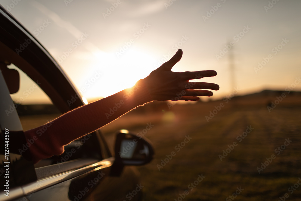 © kieferpix - Carefree traveler with arms out car window enjoying the warm sunshine © kieferpix - Carefree traveler with arms out car window enjoying the warm sunshine