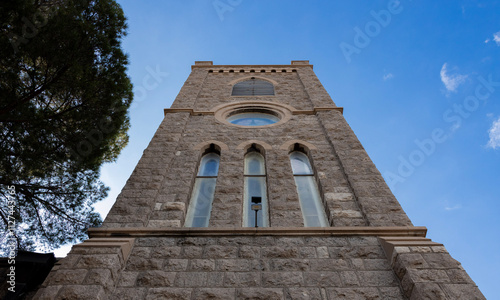 church wall looking towrads blue sky
