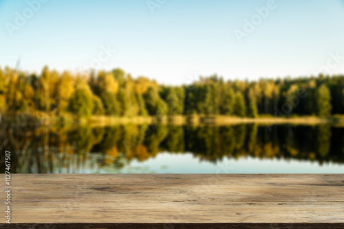 Fototapeta Naklejka Na Ścianę i Meble -  Wooden table with forest lake and nature background. Product display background.