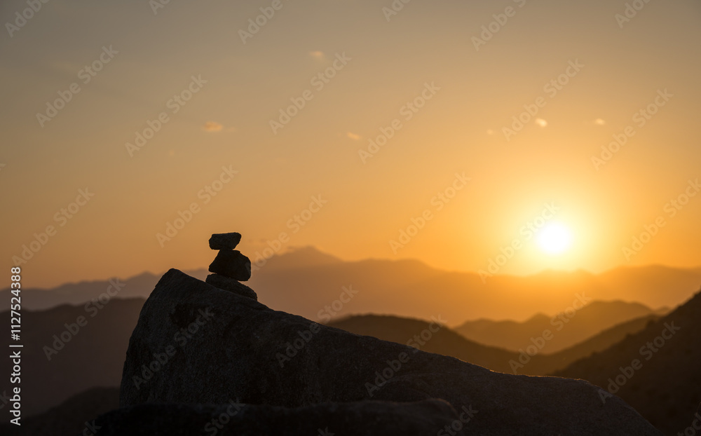 Pile of stones and sunset in Joshua Tree National Park, California Pile of stones and sunset in Joshua Tree National Park, California